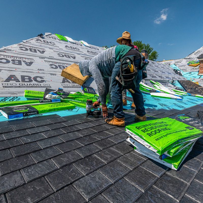 Synthetic slate roof on a brick house